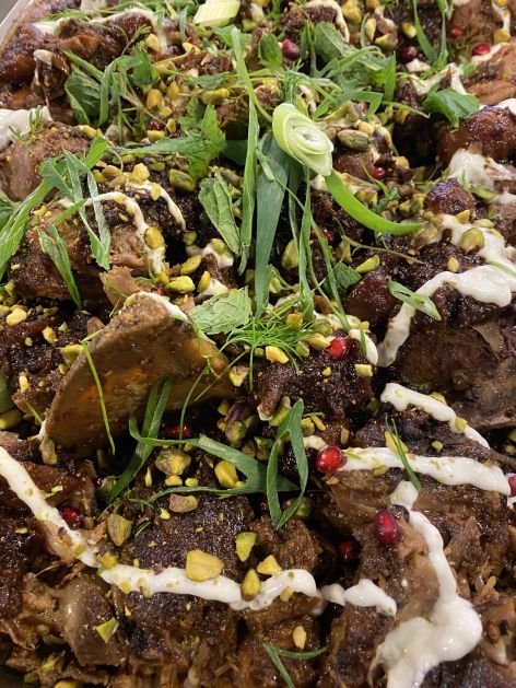 Slow cooked lamb shoulder with pistachio, and pomegranate