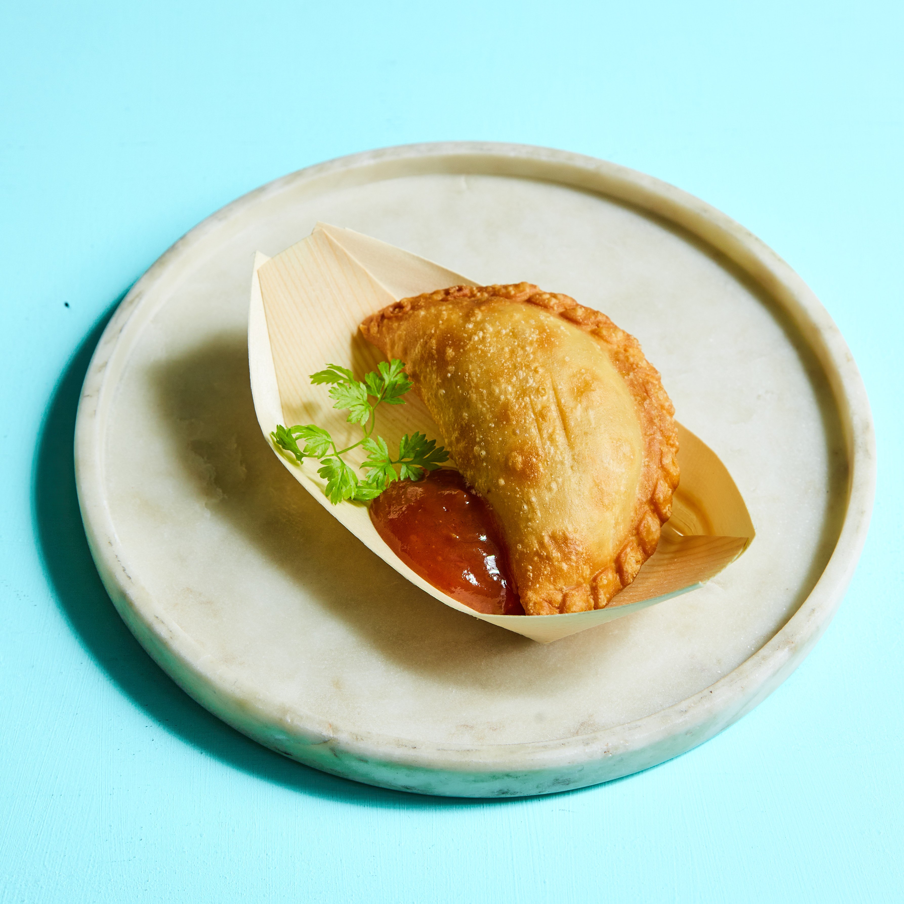 Classic beef and black olive empanada with habanero relish