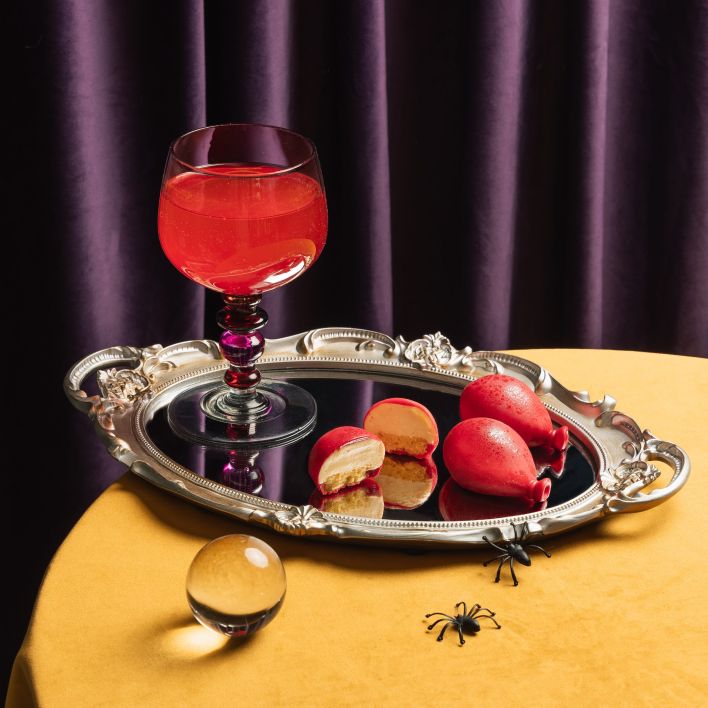 Red balloon shaped desserts filled with orange almond sponge and cream