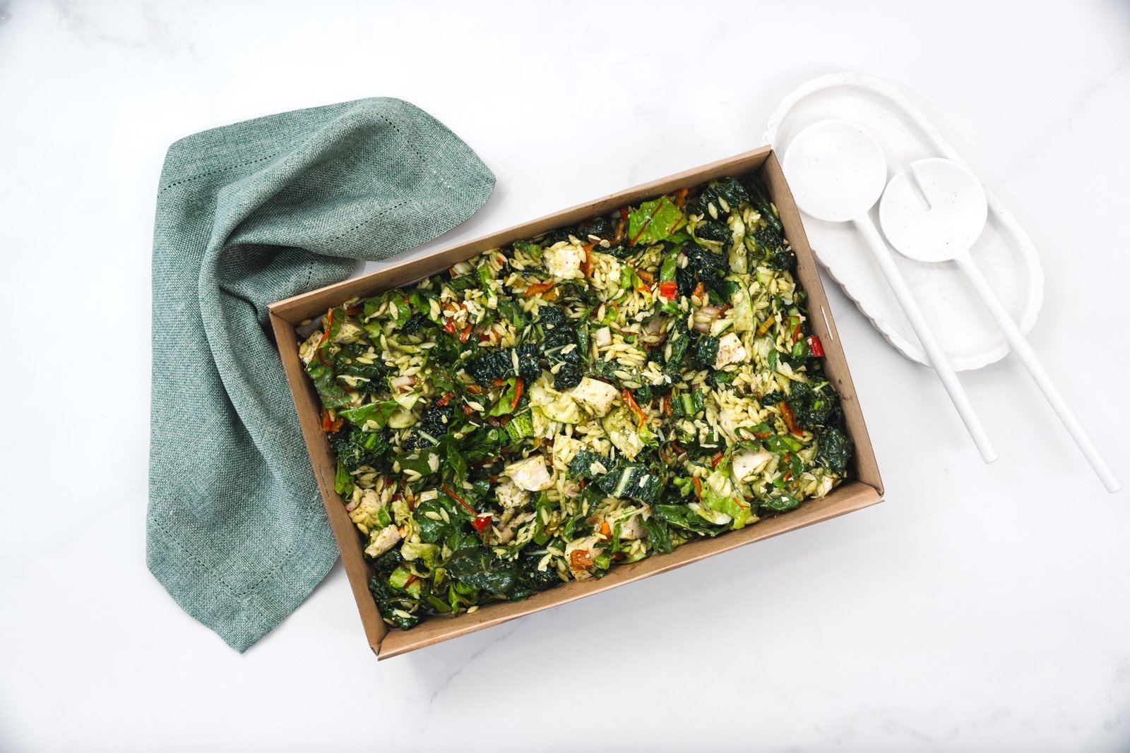 Large Risoni Pasta Salad, Grilled Chicken, Sun Dried Tomato, Kale, Zucchini Ribbons, Parmesan & Pesto Feeds 10-12