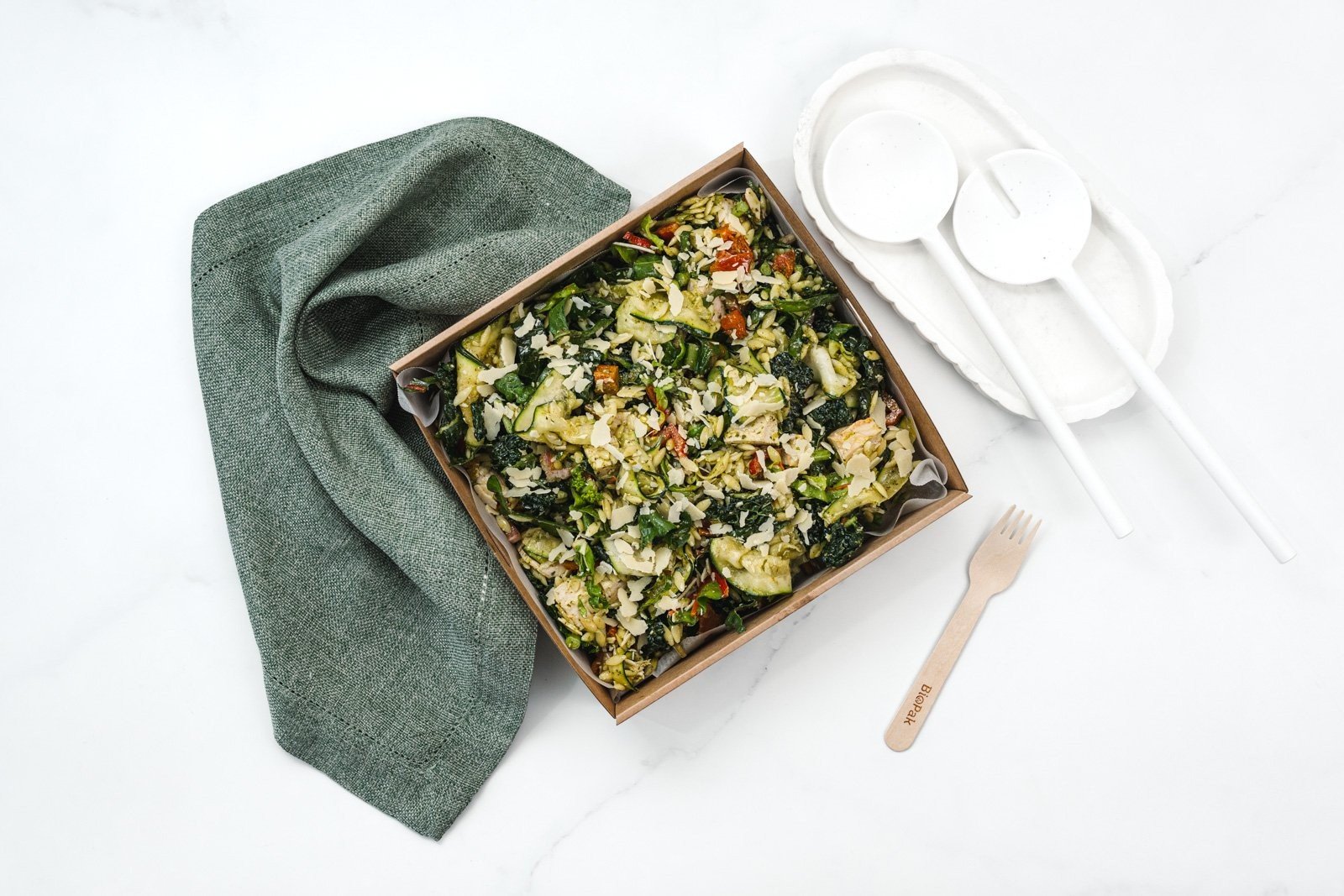 Small Risoni Pasta Salad, Grilled Chicken, Sun Dried Tomato, Kale, Zucchini Ribbons, Parmesan & Pesto Feeds 8-10