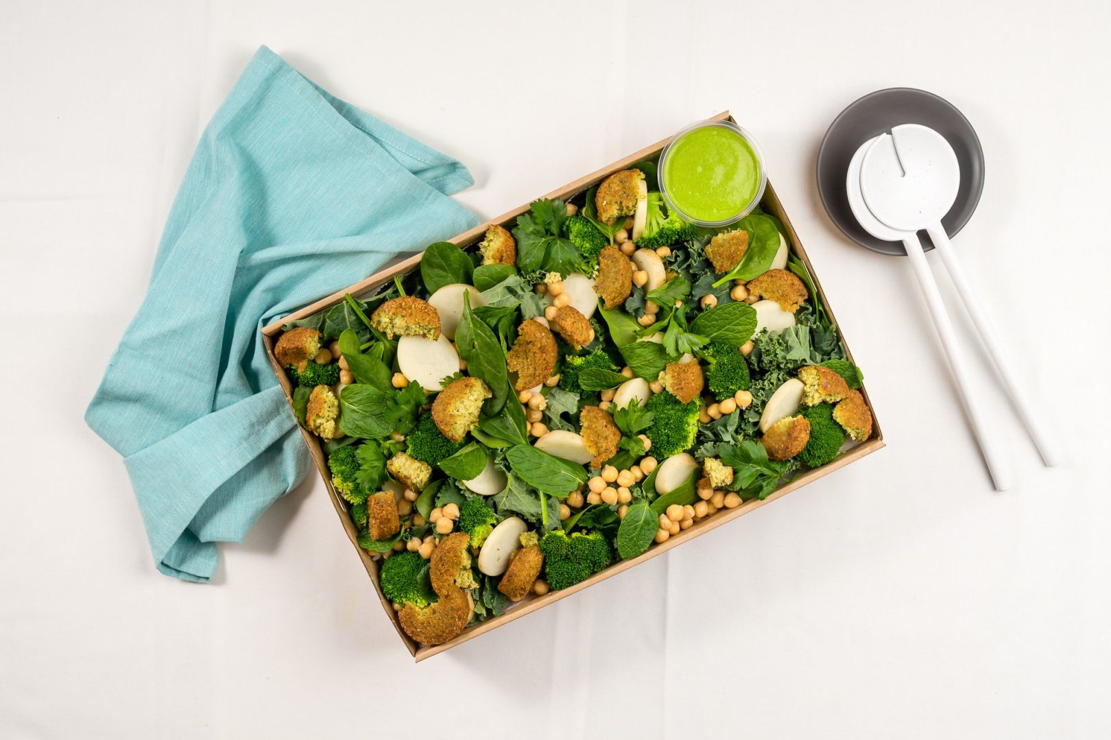 Green Goddess Salad, Smashed Falafel, Kale, Broccoli, Zucchini, Potato, Chickpeas, Baby Spinach, Creamy Green Goddess Yoghurt dressing, Parsley & Mint
