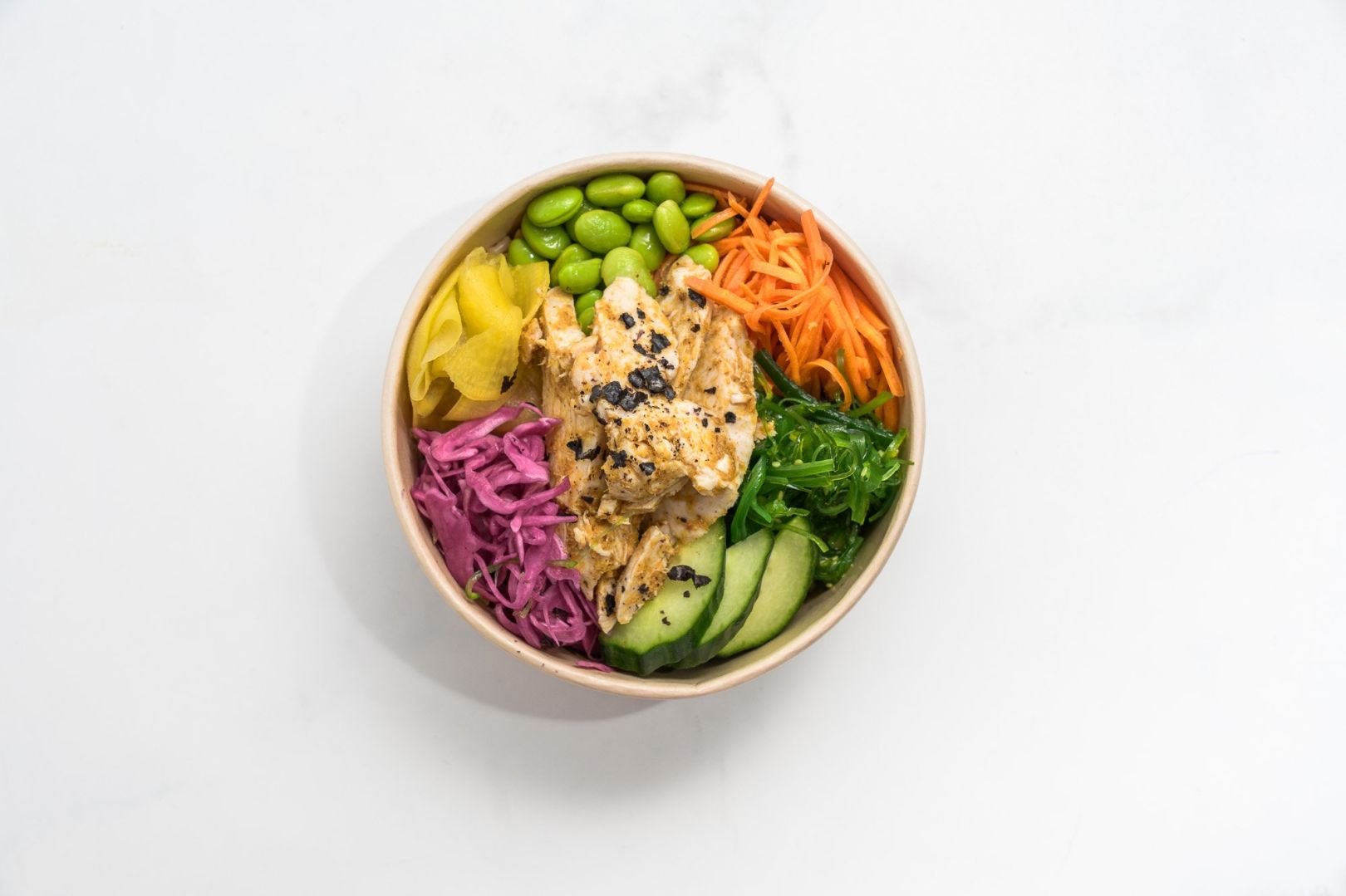 Protein Poke Bowl, Soy and Nori Brown Rice, Pickled Carrot, Wakame, Edamame, Pickled Red Cabbage, Cucumber, Radish, and Pickled Ginger 
