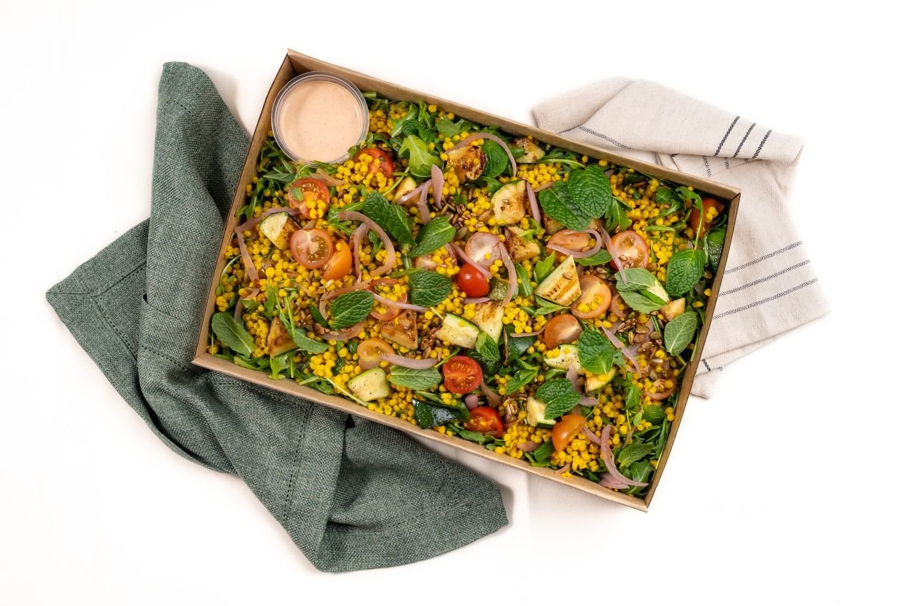 Nut Free, Turmeric Pearl Cous-Cous Salad, Chargrilled Zucchini, Cherry Tomatoes, Pickled Red Onions, Roquette, Spiced Seeds, Yoghurt & Harissa Dressing