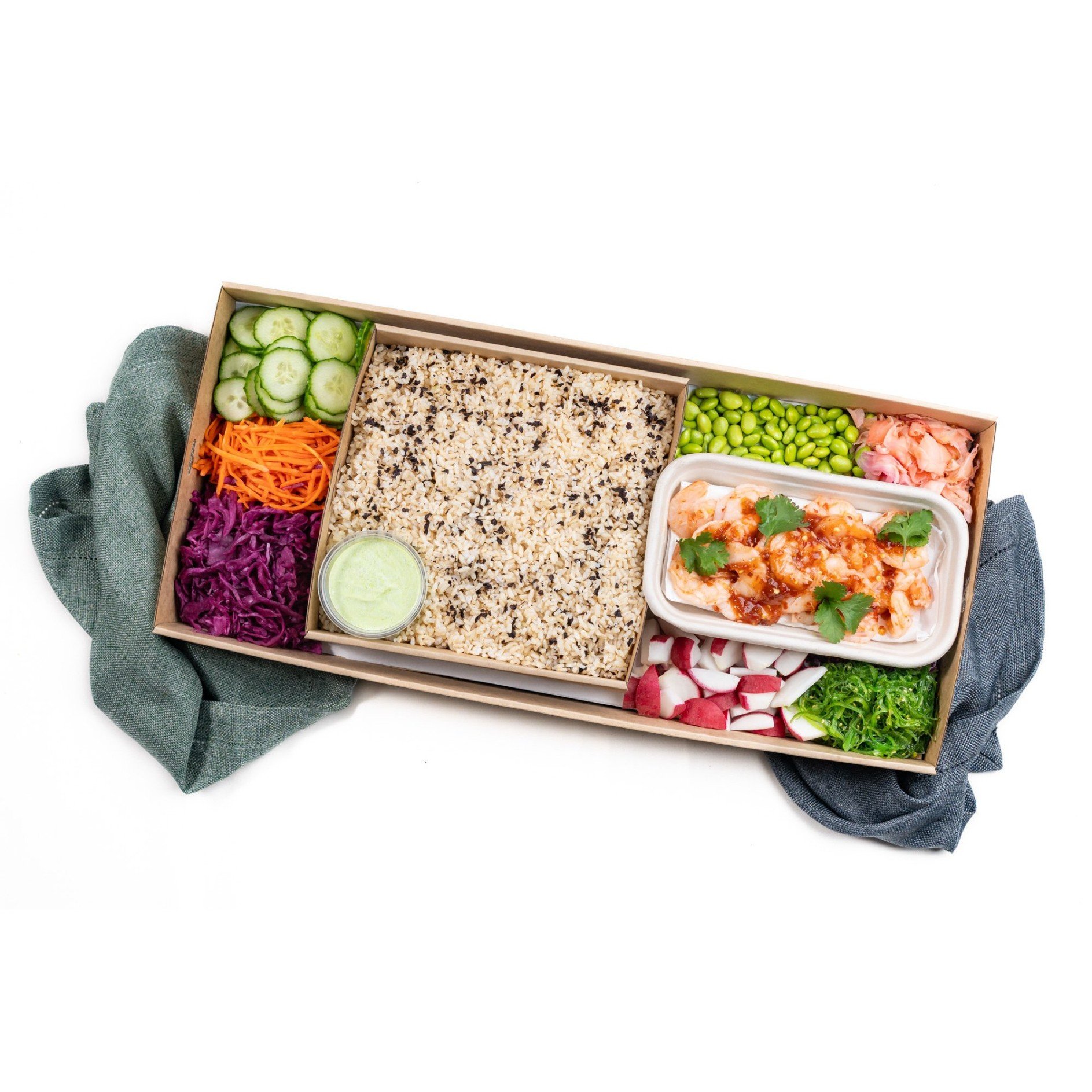 Prawn poke bowl with edamame, carrot, wakame, cucumber and pickled cabbage.