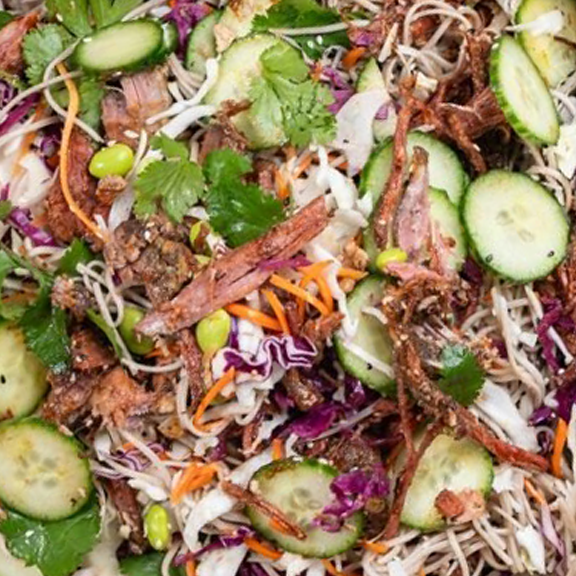 Pulled Marinated Beef Brisket Soba Noodle Salad Bowl, Pickled Red Cabbage, Carrot, Cucumber, Edamame, Crispy Shallots, Sesame Seeds & Coriander With Soy and Mirin Dressing