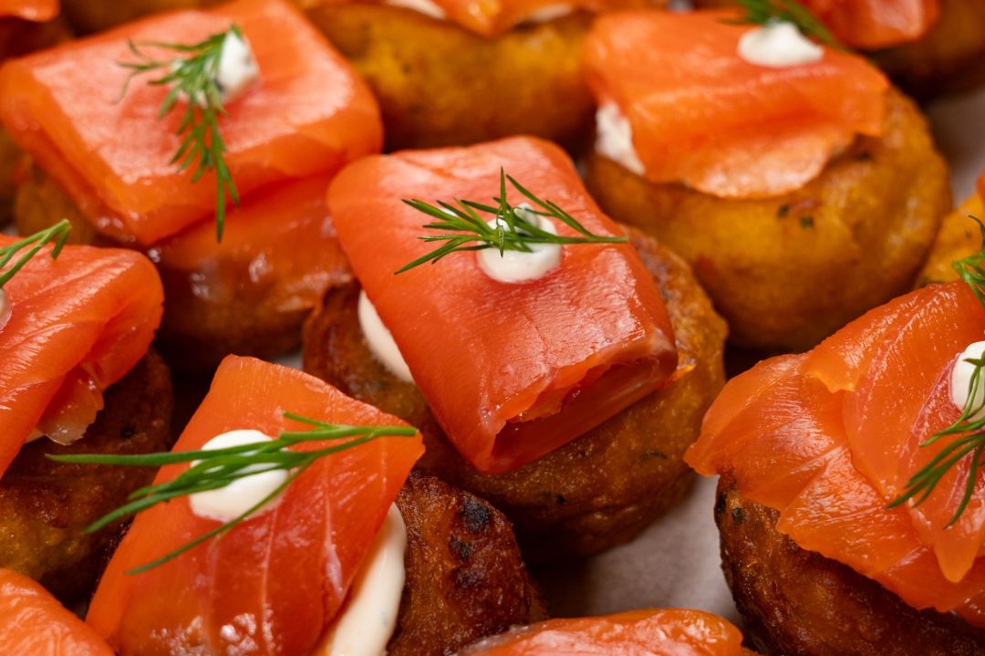 Salmon Fritter Box - Sweet corn fritters served with dill sour cream, smoked salmon, pickled red onion and fresh dill