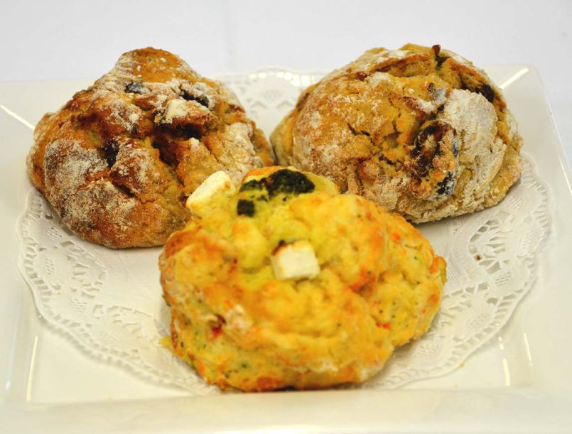 Scones - A mixture of Sweet and Savoury with butter, jam, cream and utensils.