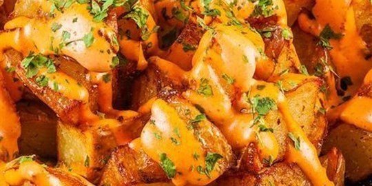 Patatas Bravas. Spanish onion canape.