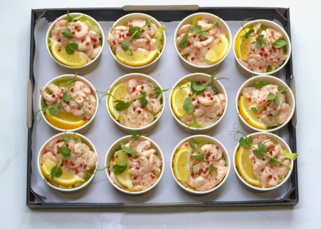 PRAWN COCKTAIL - housemade seafood dressing, chilled prawns on a bed of shredded iceberg lettuce, lemon wedge & sprinkle of crushed red peppercorns. Individual bowl with wooden fork (GF)