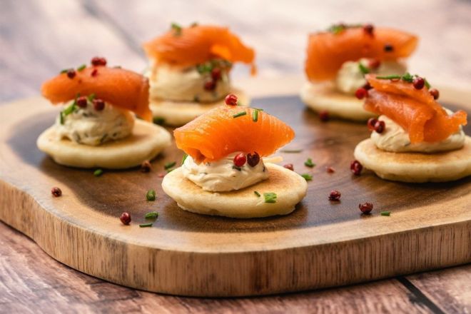 SMOKED SALMON BLINI Canape with whipped citrus herb cream cheese 