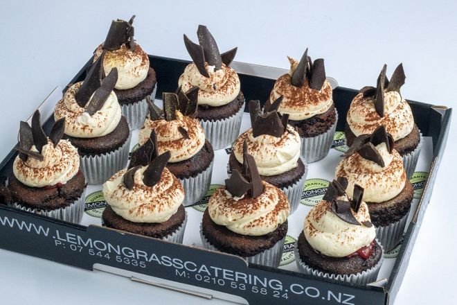 BLACK FOREST CUPCAKES - Chocolate cupcakes filled with black cherry compote, topped with mascarpone frosting, maraschino cherry & dark chocolate shards - presented on black biodegradable platter 