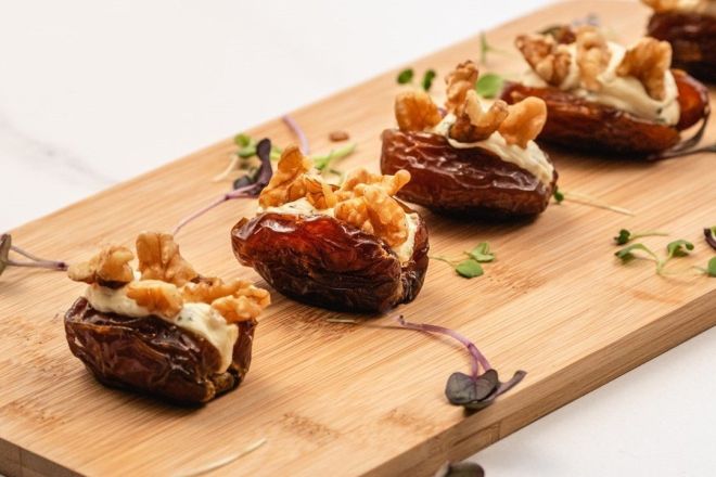 MEDJOOL FRESH DATES stuffed with whipped feta cumin & honey cream cheese, topped with chopped toasted walnuts canape (GF, V)