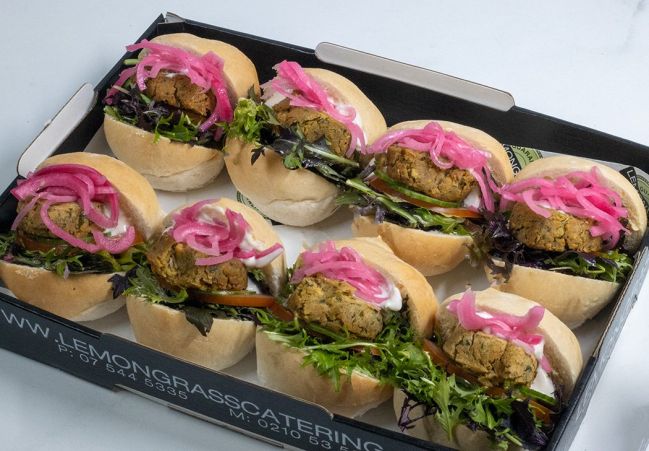 FALAFEL SLIDERS with Chickpea & herb falafel, vegan mayonnaise, relish, salad greens & sliced pickled red onions (VEGETARIAN, DF, VEGAN). Served warm 