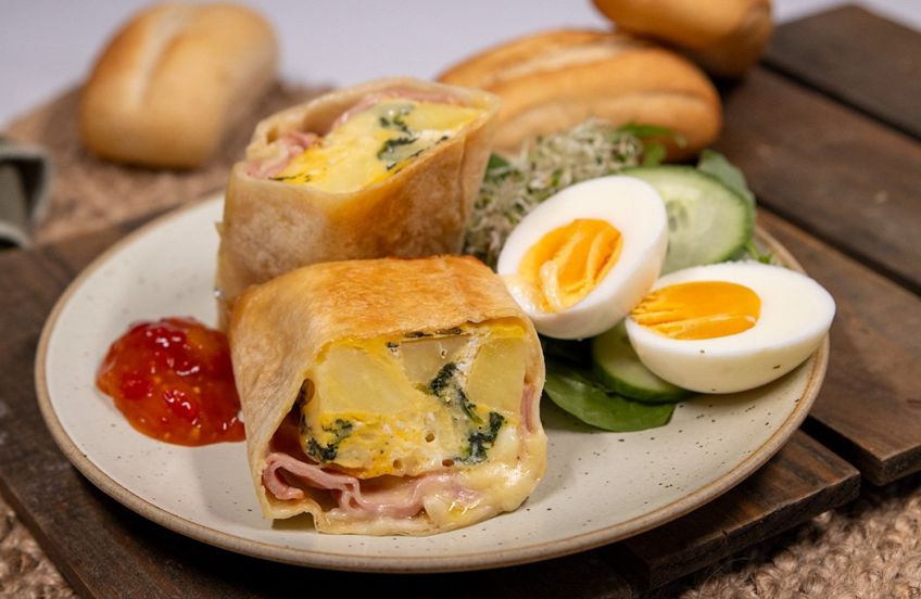 BREAKFAST BURRITO  - shaved ham, cheese, Frittata with hash brown-spinach-red peppers-egg with cheese sauce wrapped in a large soft wrap - hot and individually wrapped in foil