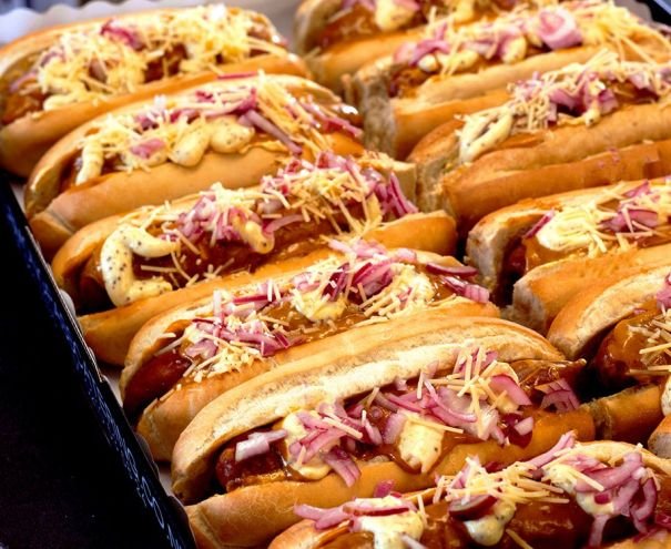 BREAKFAST HOTDOG - frankfurter sausage, frittata with eggs & hasbrown, topped with mustard mayo, tomato relish, pickled red onions & parmesan cheese served in a large baguette roll - hot