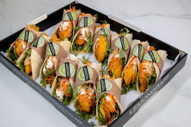CHICKEN TACO - Crumbed chicken fillet with fresh salad greens, grated cheese, shredded cabbage, carrot, honey mustard mayo sauce & toasted seeds in a soft taco - Served Cold