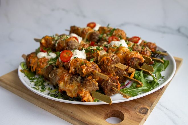 BEEF MEATBALL SKEWER PLATTER - 15 Large skewers1 (5 meatballs per skewer) glazed in Teriyaki sauce, sesame seeds & dollops of creamy garlic aioli - Hot 