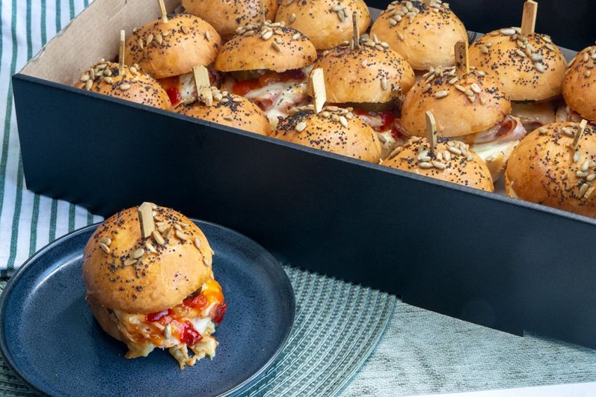 HAM AND CHEESE HOT MIDI ROLLS with garlic butter, ham, cheese, capsicum & apricot relish, gherkins & heated in oven - served hot