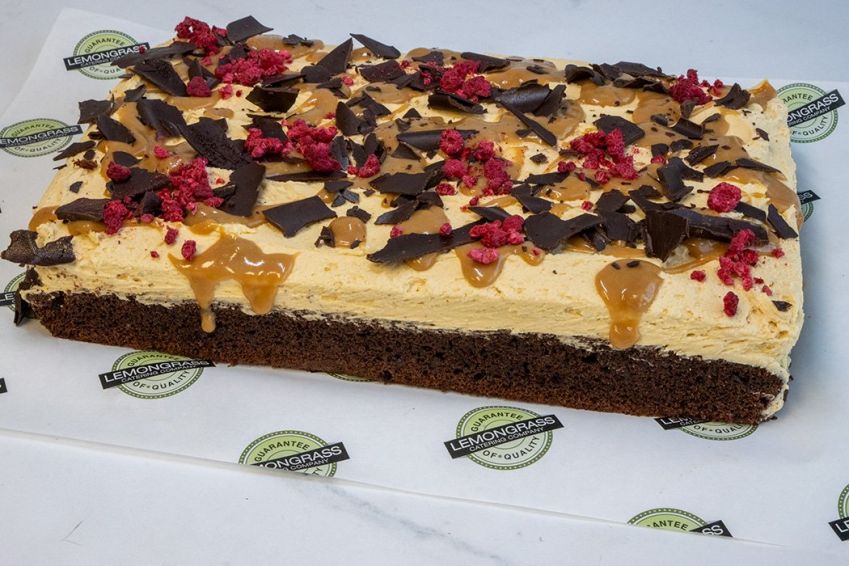 CHOCOLATE AND CARAMEL CAKE SLAB - 25 x 30 cm -  Chocolate cake topped with caramel buttercream icing & drizzled with salted caramel swirls. Served whole