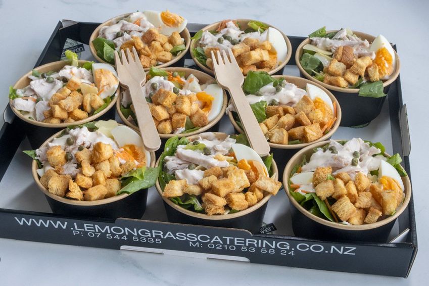 CHICKEN CAESAR SALAD TUBS  - chicken, cos lettuce, boiled eggs, parmesan cheese, croutons & caesar dressing. Individual round salad tub with wooden fork