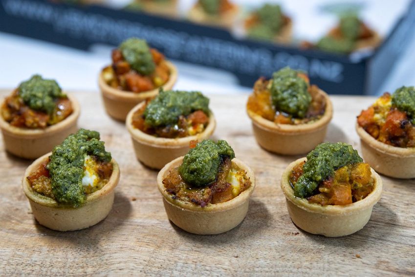 ROAST VEGETABLE & FETA TART CANAPE Slow roasted vegetables with feta, sweet chili & basil pesto served in a savoury tart shell (V) Served warm 