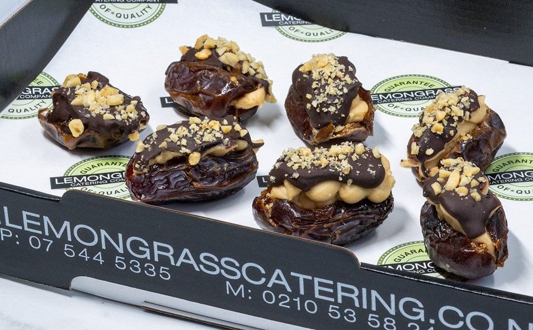 MEDJOOL FRESH DATES with peanut butter whipped cream cheese, topped with toasted salted peanuts 