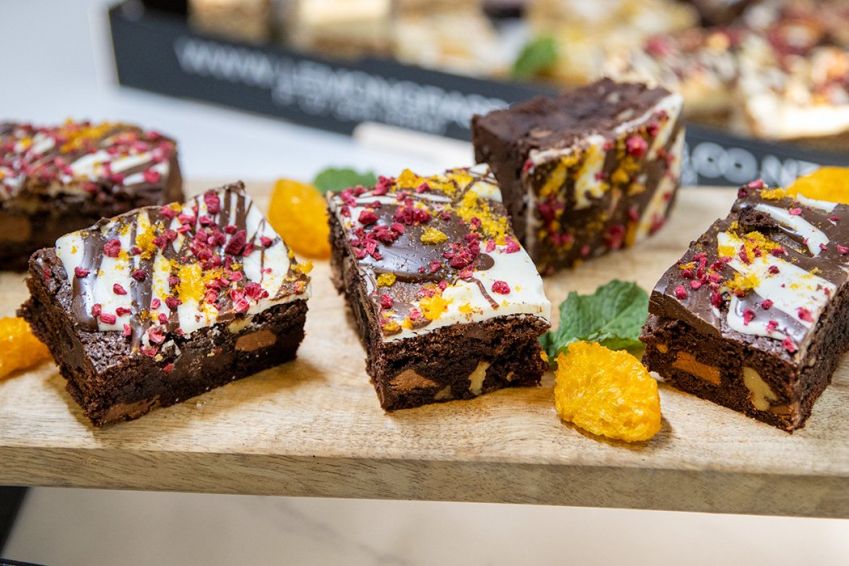 TRIPLE CHOCOLATE & WALNUT BROWNIES topped with white & dark chocolate and freeze dried raspberries - Our Signature Bake  