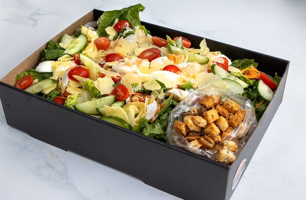 CAESAR SALAD BOX - Cos leaves, soft boiled eggs, shaved parmesan, grated carrot, chopped tomatoes, croutons with side tub of creamy caesar dressing 