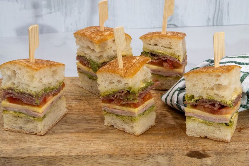 ITALIAN CLUB SANDWICH BITES PLATTER (20) - Ciabatta bites filled with basil pesto, ham, salami, shaved parmesan, roasted red pepper - Skewered