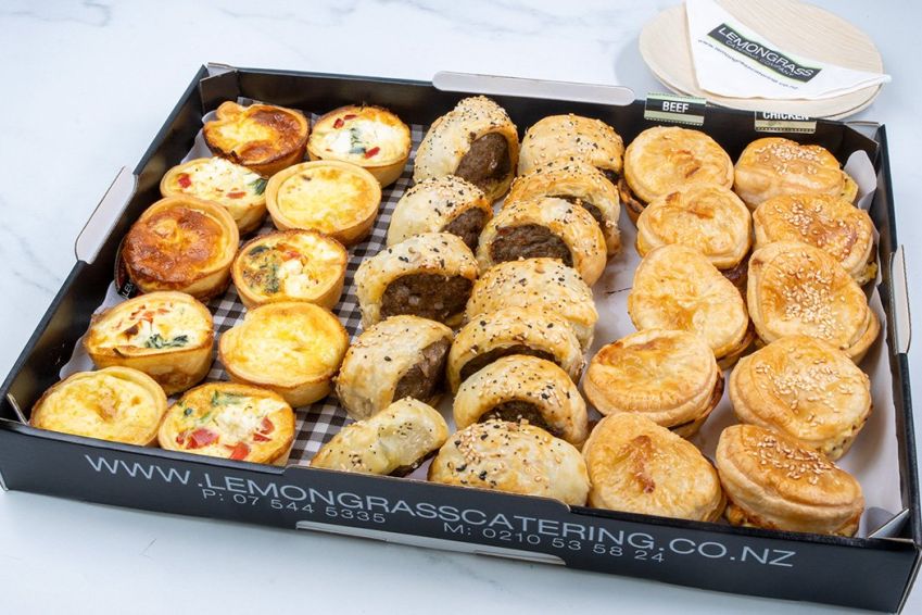 PARTY SIZE SAVOURY VARIETY PLATTER (32): 5 Beef pie, 5 butter chicken pie,, 5 Spinach feta red pepper quiche, 5 Caramelized onion brie quiche, 12 beef sage and onion sausage rolls 