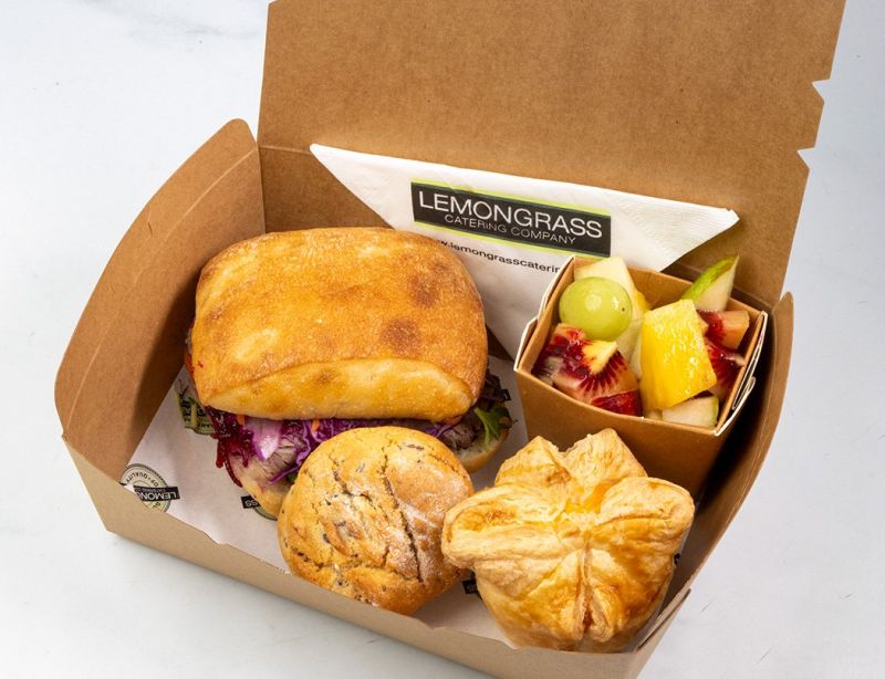 KIWI FAVOURITES PICNIC BOX (Large filled roll, Bacon & egg pie, Daily Sweet, Fresh fruit served in noodle box) 
