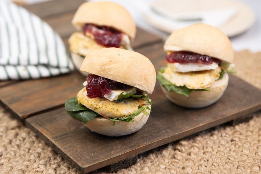 CHICKEN BRIE & CRANBERRY SLIDER - marinated chicken tender, fresh salad greens, brie cheese, cranberry sauce & mayo - served warm 