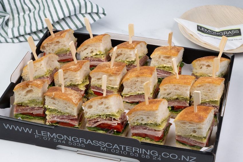 ITALIAN CLUB SANDWICH BITES PLATTER (20) - Ciabatta bites filled with basil pesto, ham, salami, shaved parmesan, roasted red pepper - Skewered