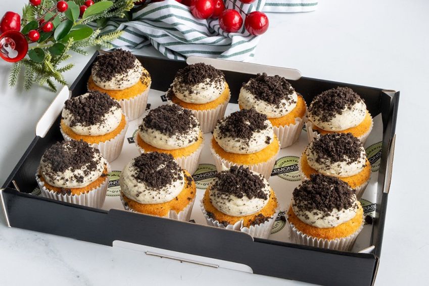 COOKIES AND CREAM CUPCAKE BOX (12) -  Vanilla bean cupcake filled with a rich chocolate centre topped with vanilla buttercream frosting & coated in crushed oreo biscuits - presented in a cupcake box with lid 