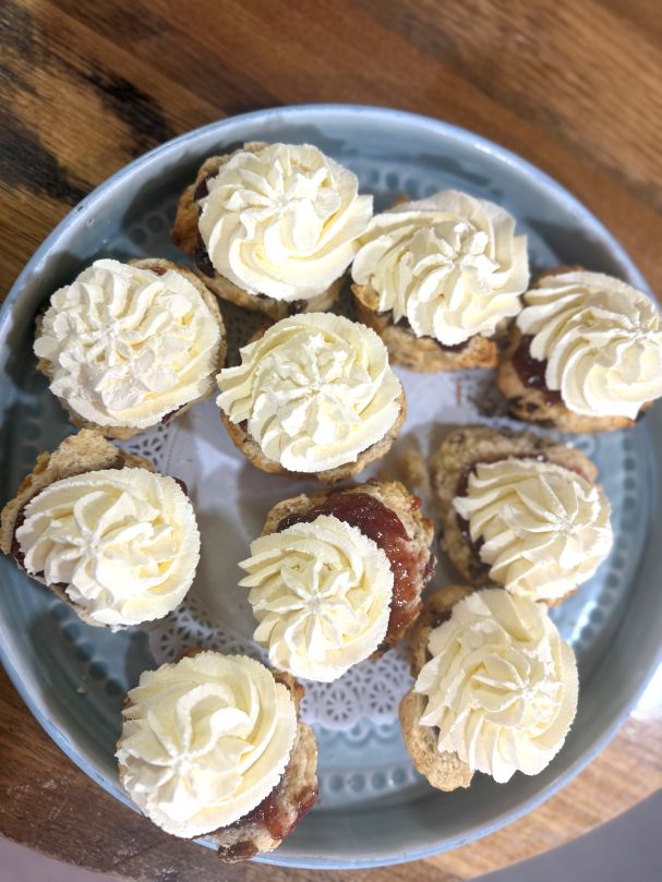 Sultana Scone Half Topped with Jam and Cream 