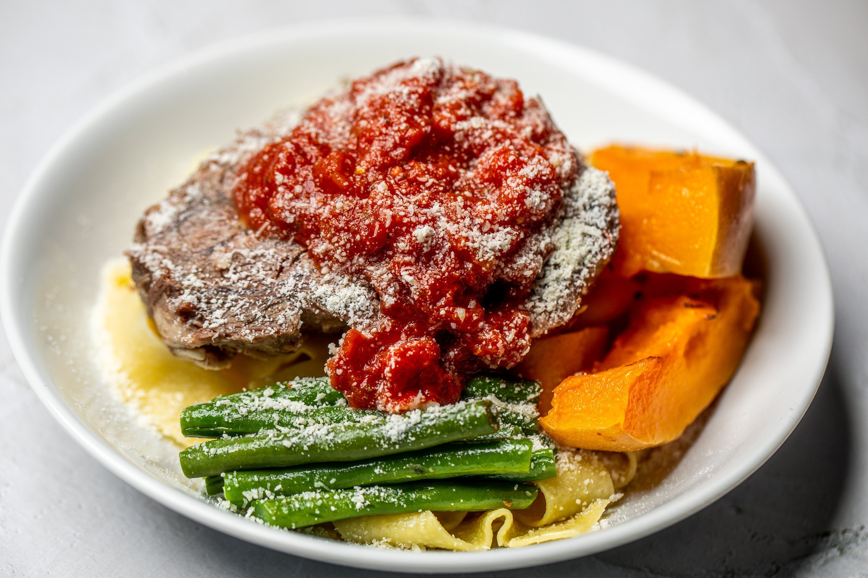 Slow cooked beef cheeks, roma tomato sauce, basil, pasta shared platter