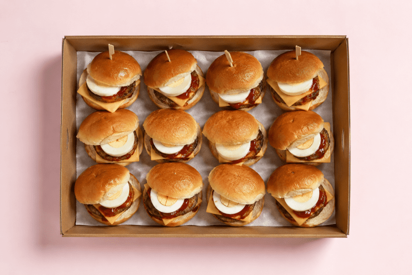 Beef sausage , soft boiled egg, cheese and ketchup slider