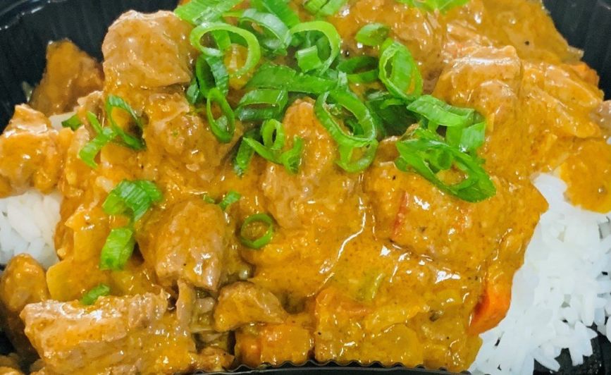 Coconut beef curry with vegetables and rice