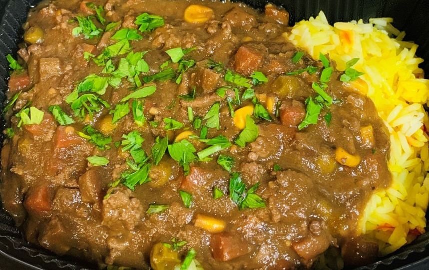 Moroccan lamb casserole with saffron rice and greens
