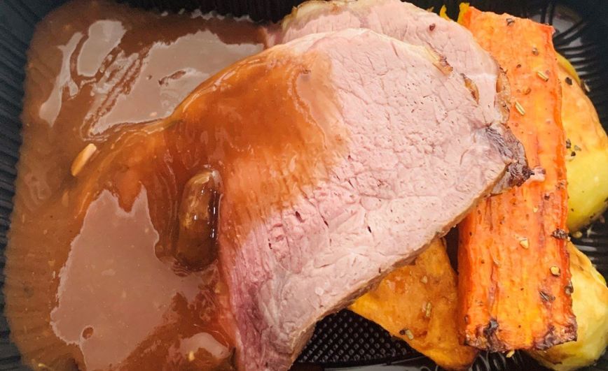 Roasted beef with baked vegetables and gravy