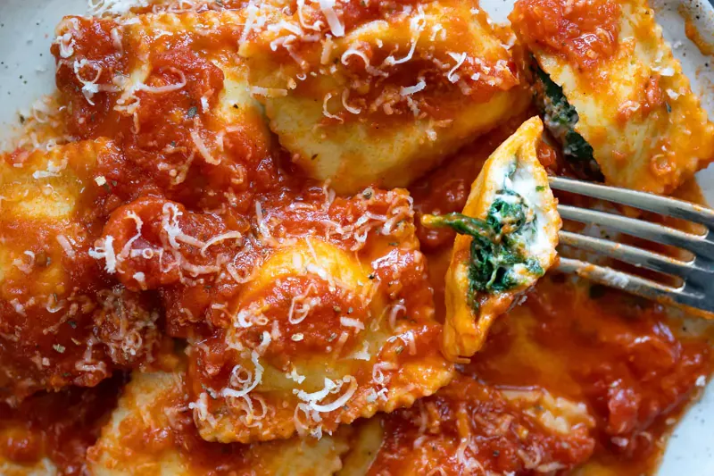 Spinach and ricotta ravioli in a rich Napoletana sauce