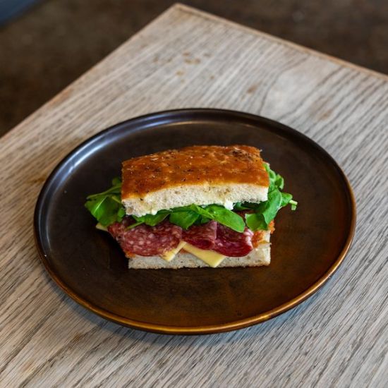 Salami, Tasty Cheese, Tomato jam, Rocket, Basil mayo on Schiacciata