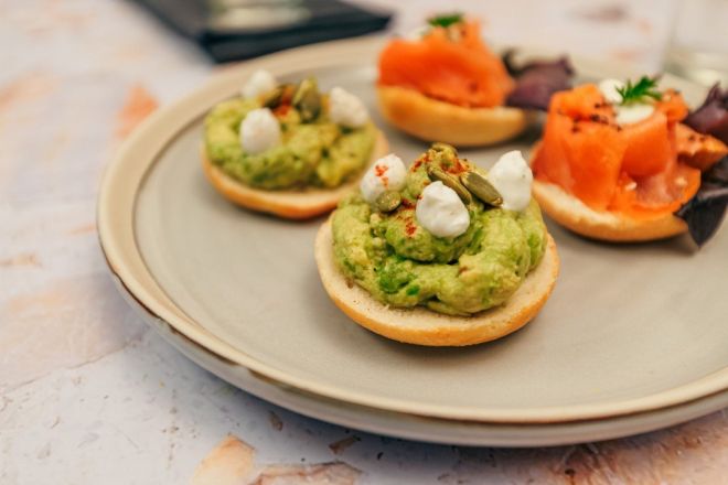 Open Mini Half Bagel, smashed avocado, desert lime, persian feta mousse v / nf