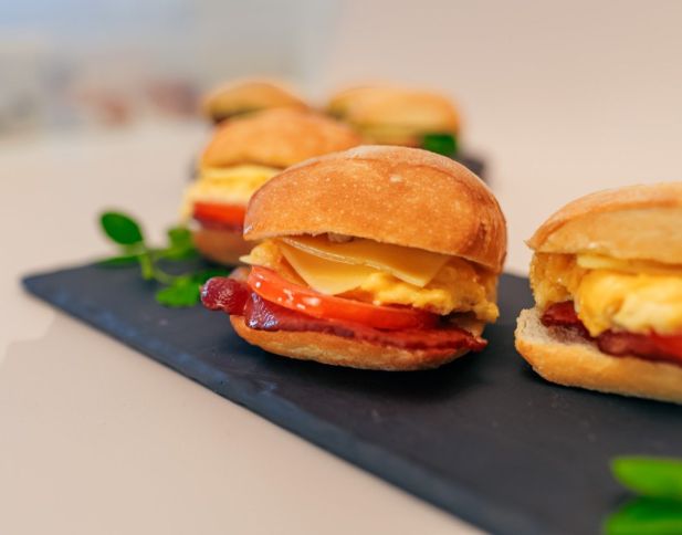 Toasted Ciabatta, served warm - Scrambled egg, bacon, tomato, tasty cheese nf