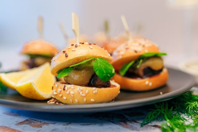 Twice Cooked Pork Belly Sliders, apple marmalade, pickle cucumber, tonkatsu sauce, sesame brioche bun nf